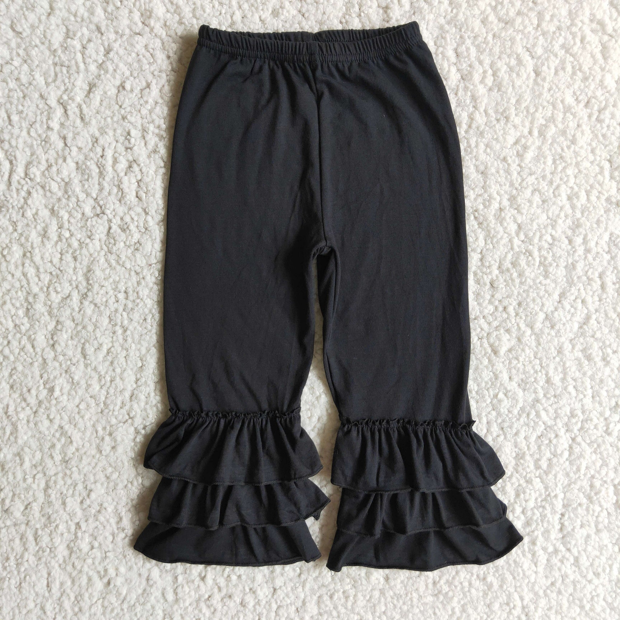 girl black ruffles winter pants